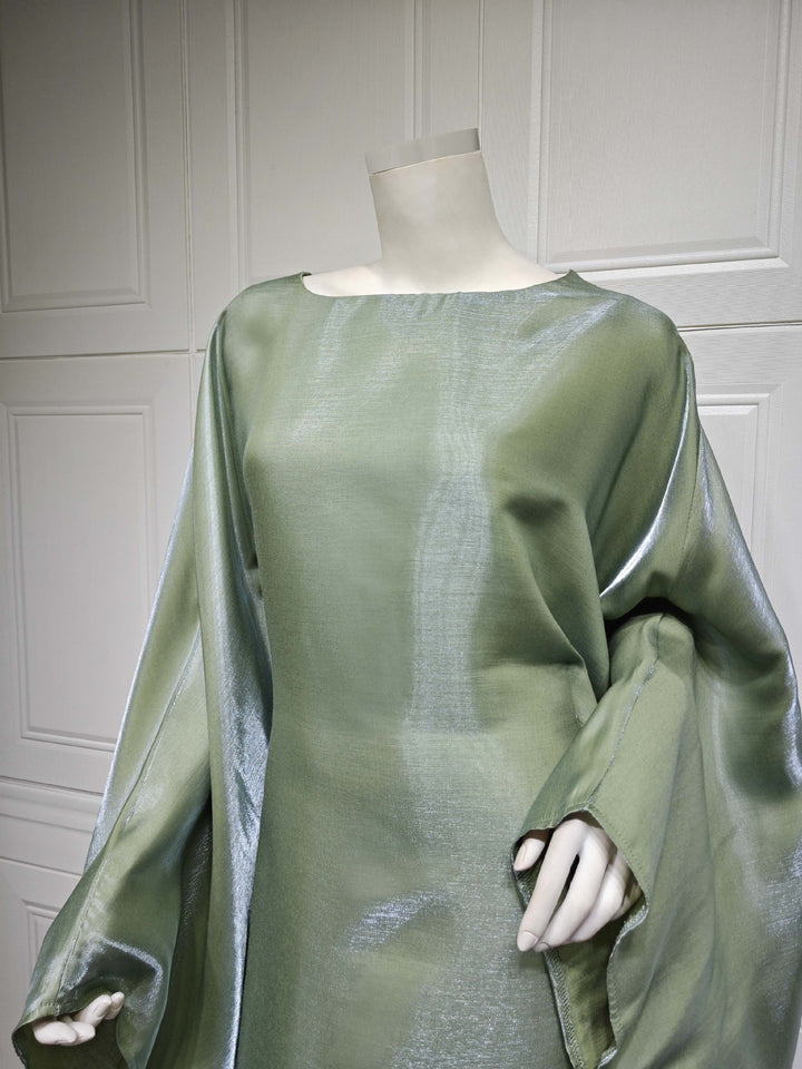Close view of the Army Green boat neckline and shimmer drape