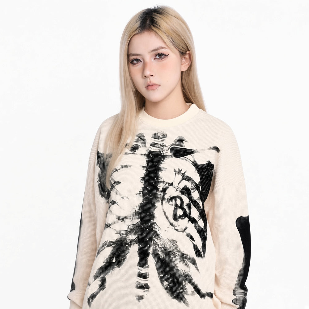 White skeleton graphic knit sweater on a woman, front view