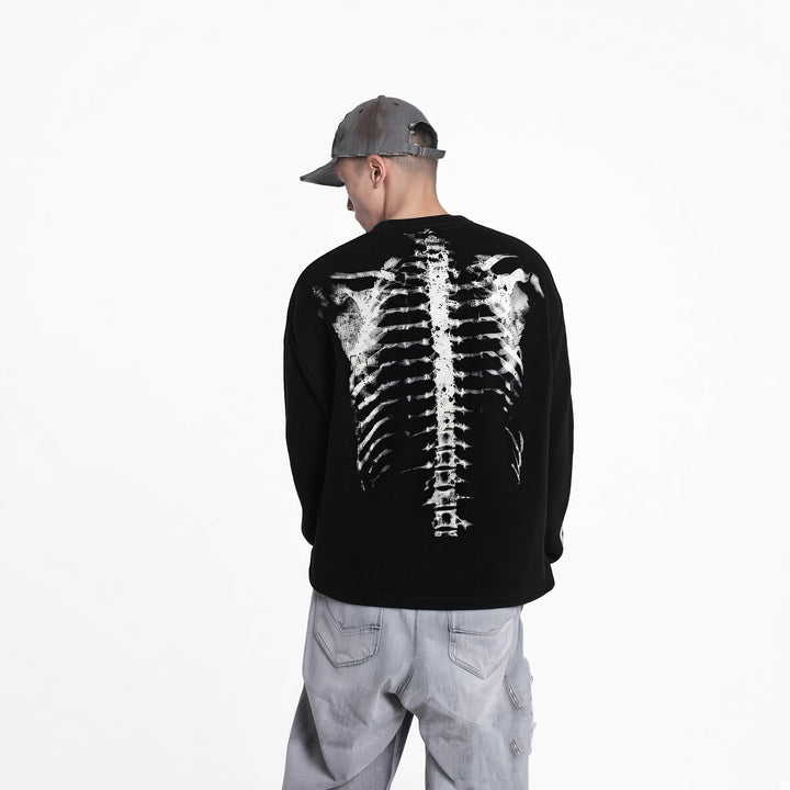 Back view of the Black unisex skeleton sweater showing the spine graphic