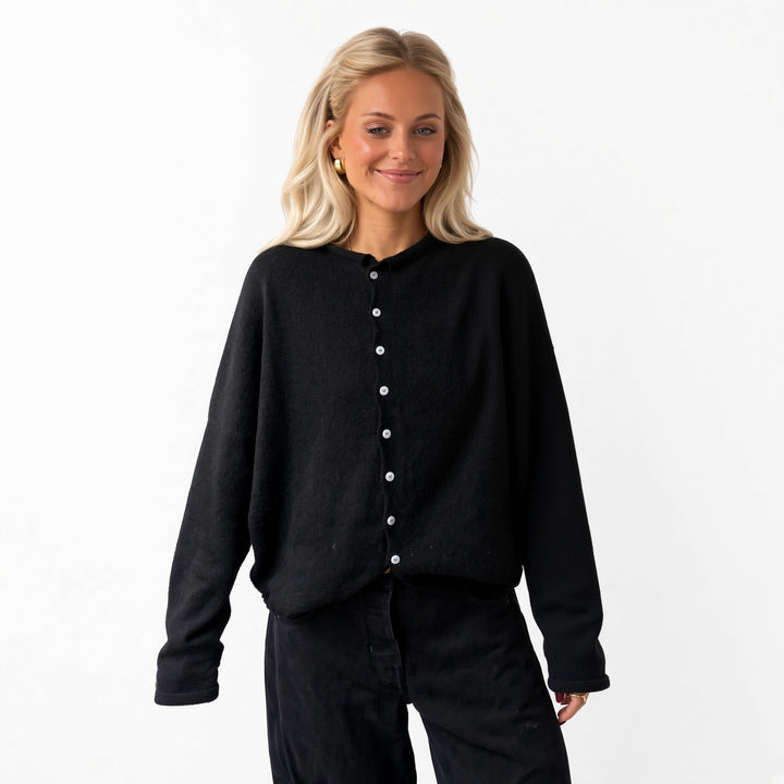 Black rolled-edge knit cardigan, front view
