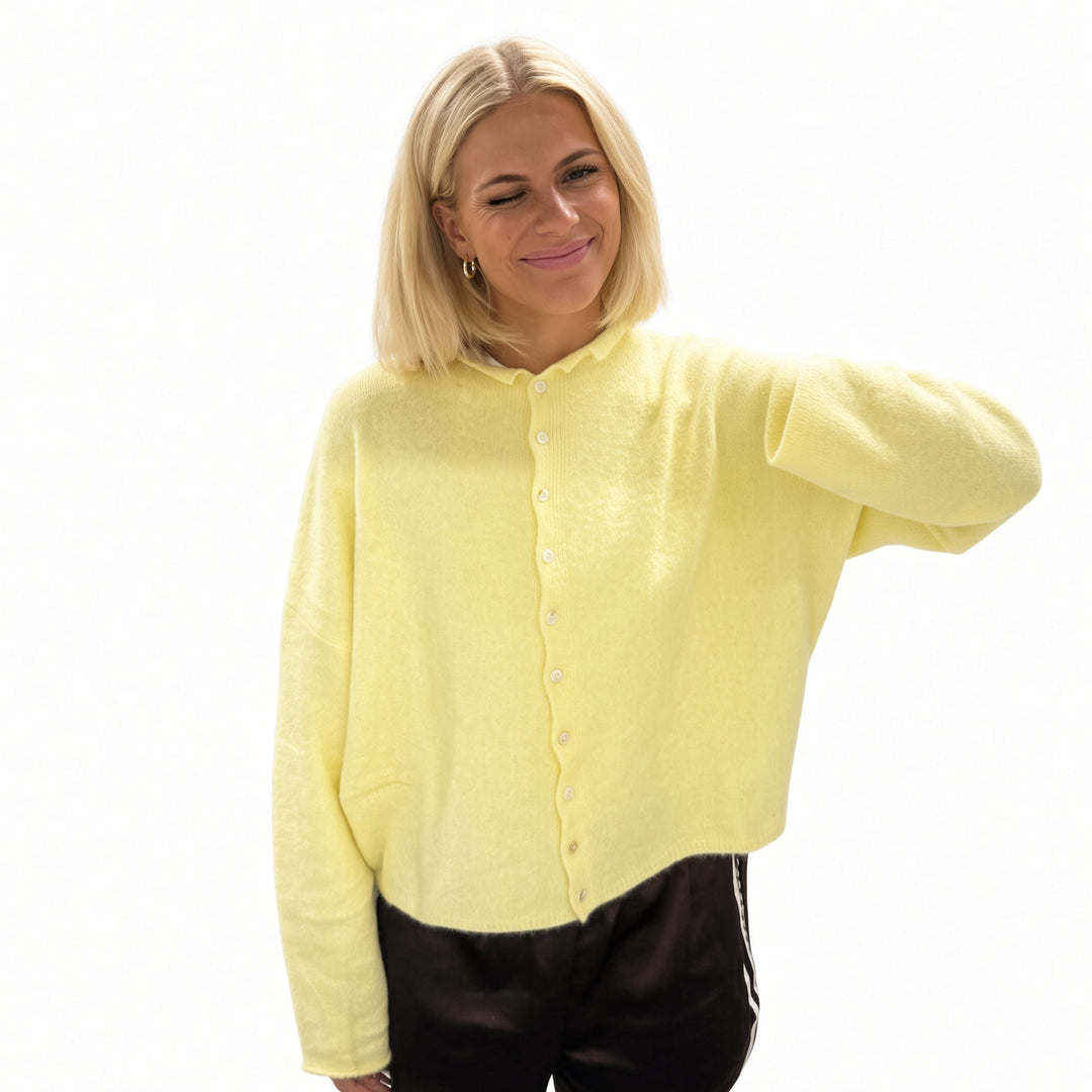 Yellow rolled-edge knit cardigan, front view