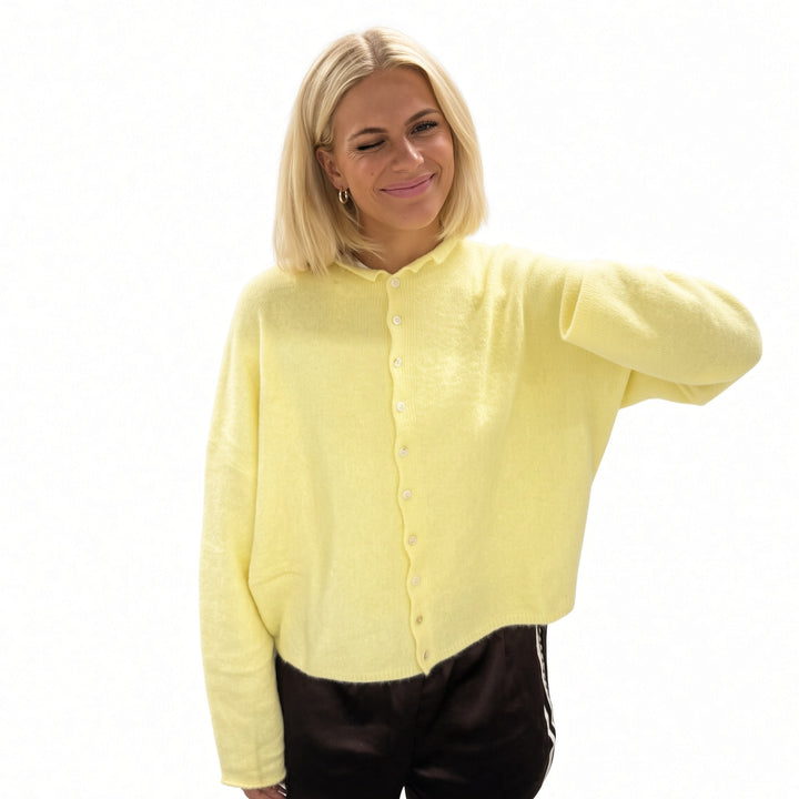 Yellow rolled-edge knit cardigan, front view