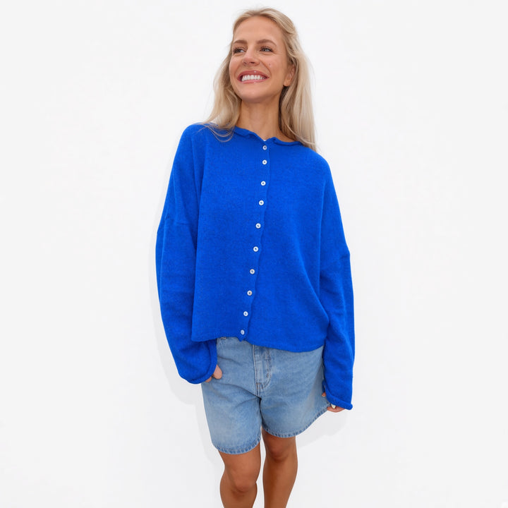 Blue rolled-edge knit cardigan, front view