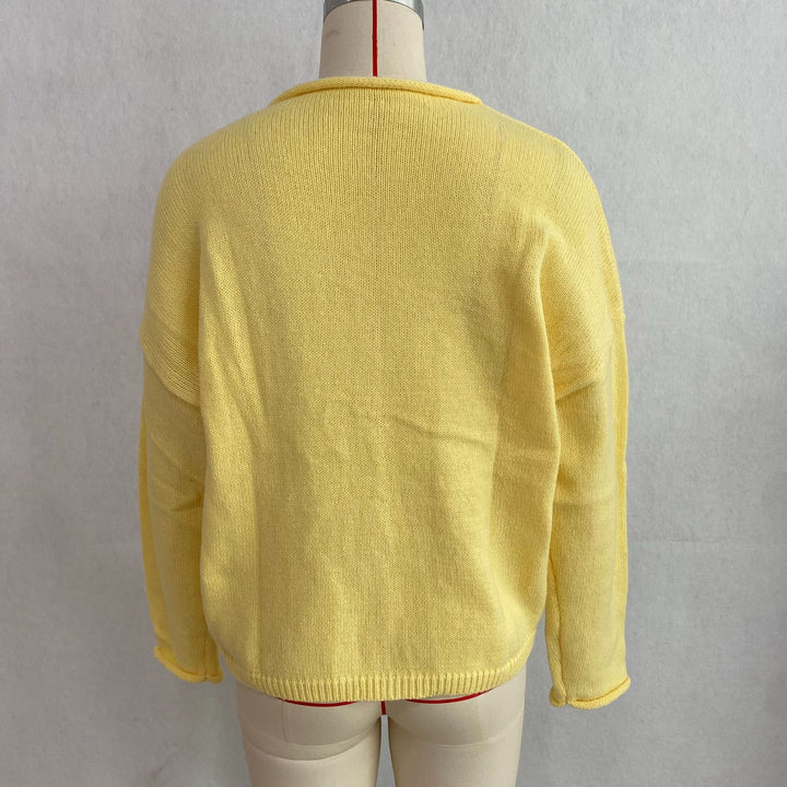 Yellow rolled-edge knit cardigan, back view on mannequin