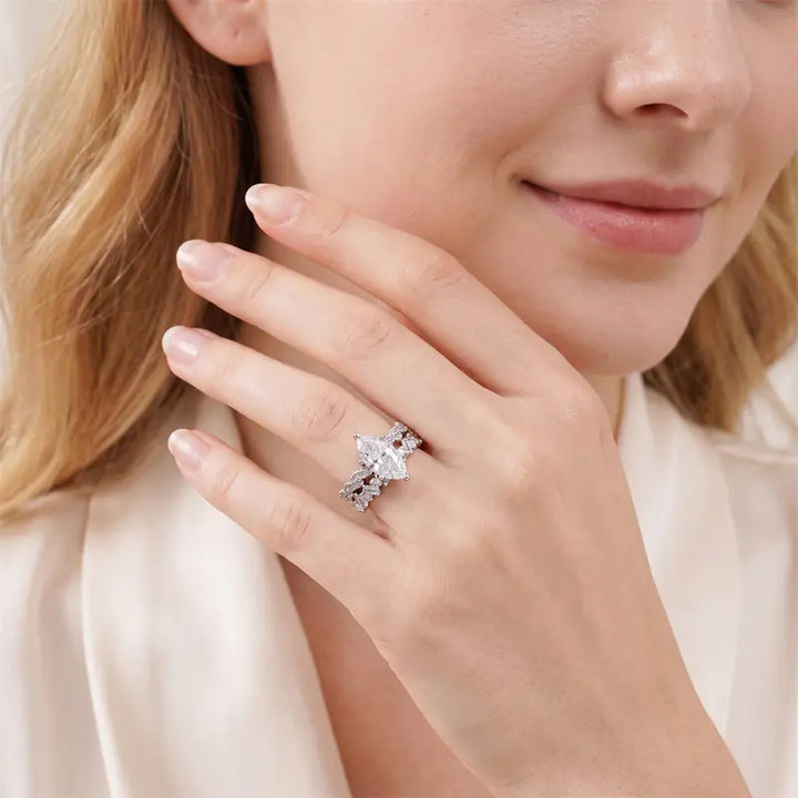 Silver-tone marquise-cut cubic zirconia ring set worn on hand