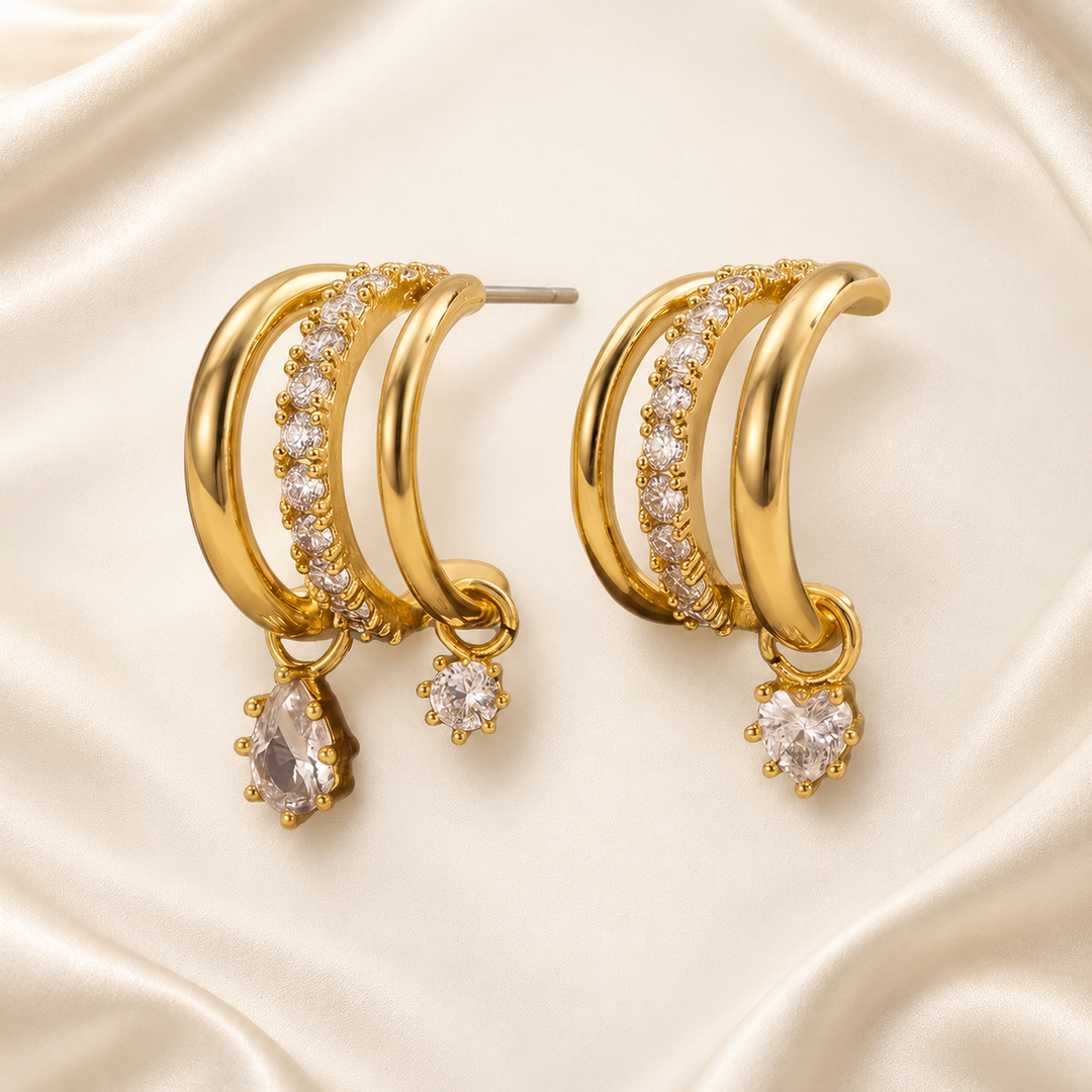 Gold-tone asymmetric triple-drop cubic zirconia earrings