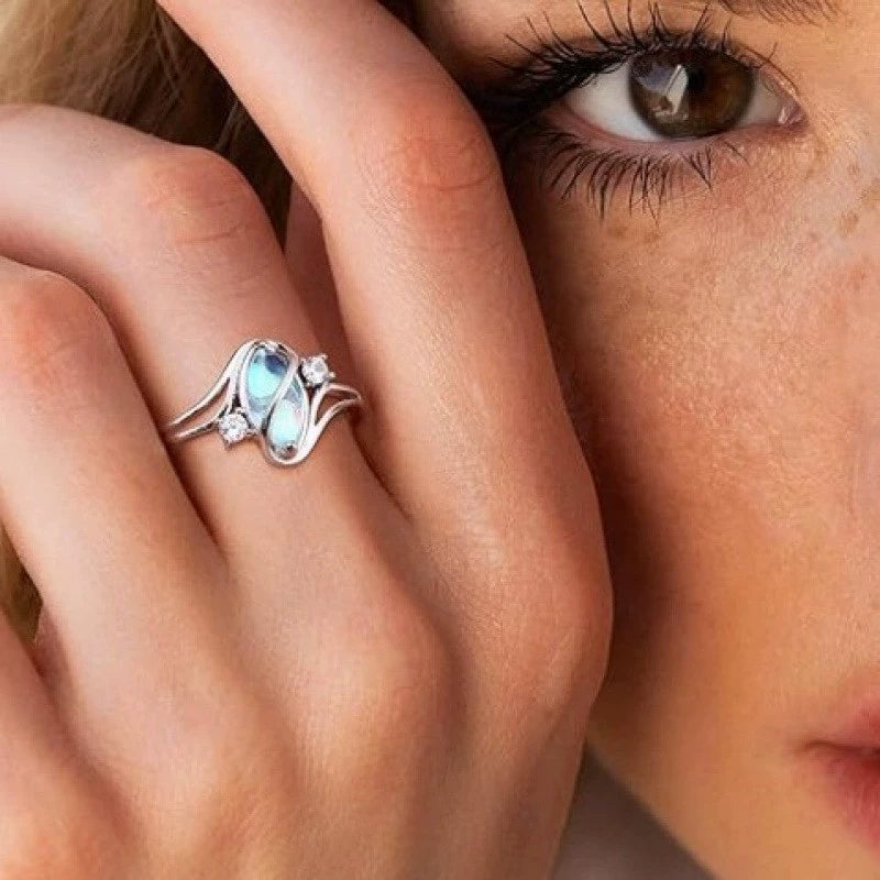 Moonstone twist-setting ring worn near face