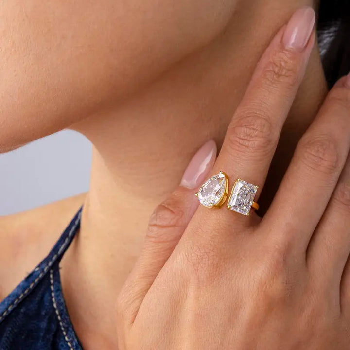 Gold-tone open ring worn on hand