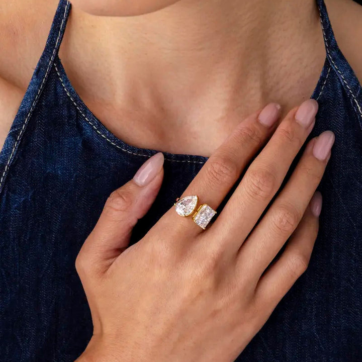 Gold-tone Toi et Moi ring hand detail