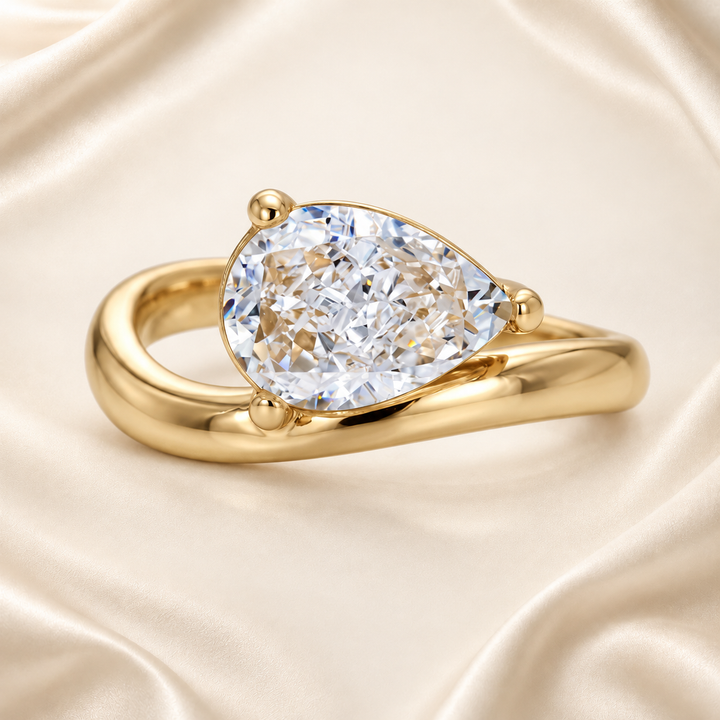 Gold-tone pear-cut cubic zirconia wavy band ring