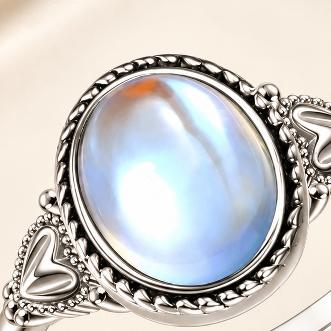 Oval moonstone-effect centerpiece and rope-edge detail