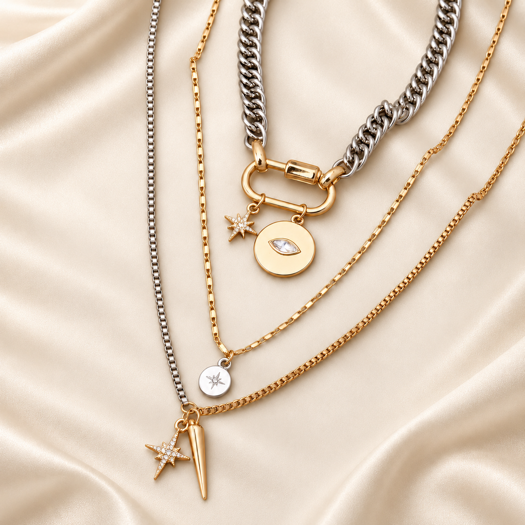 Mixed-tone evil eye layered necklace on warm cream satin