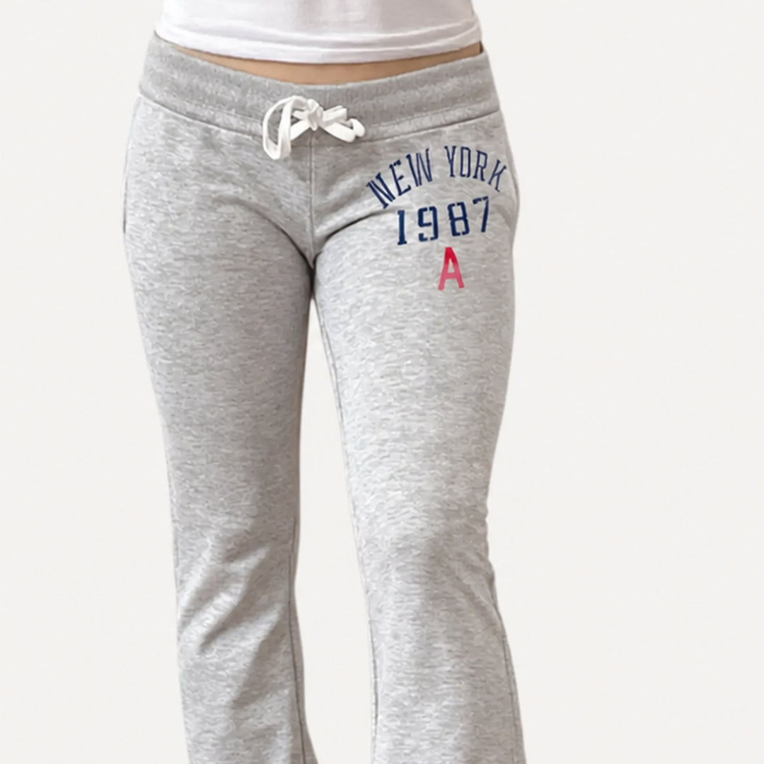 Grey drawstring waistband and collegiate graphic detail