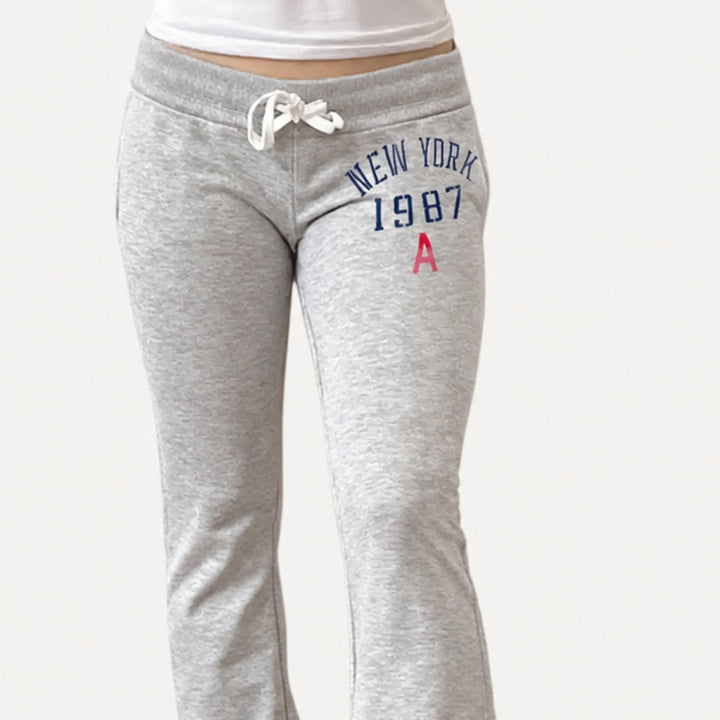 Grey drawstring waistband and collegiate graphic detail