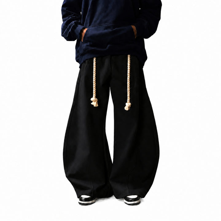 The Elara Rope-Belt Balloon-Leg Sweatpants in black, refined 4K model view