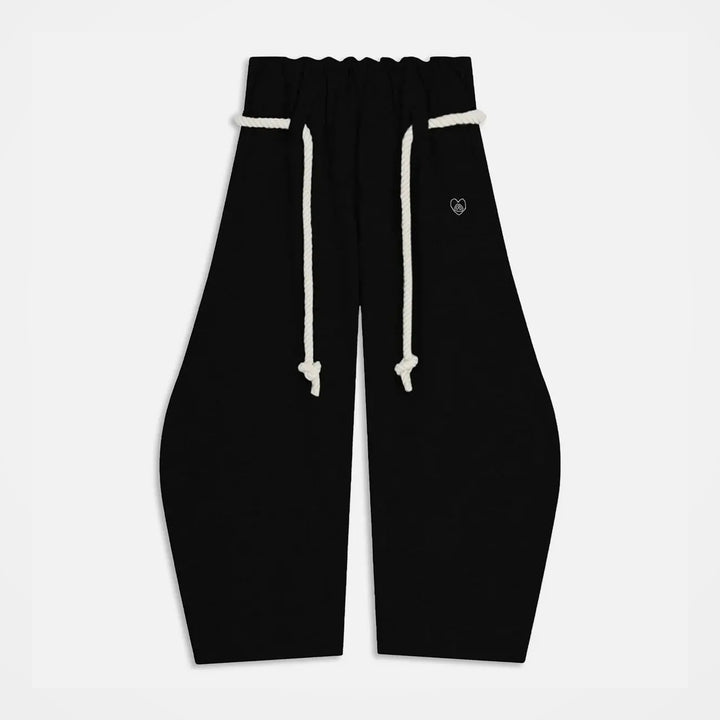 The Elara Rope-Belt Balloon-Leg Sweatpants in black, front view