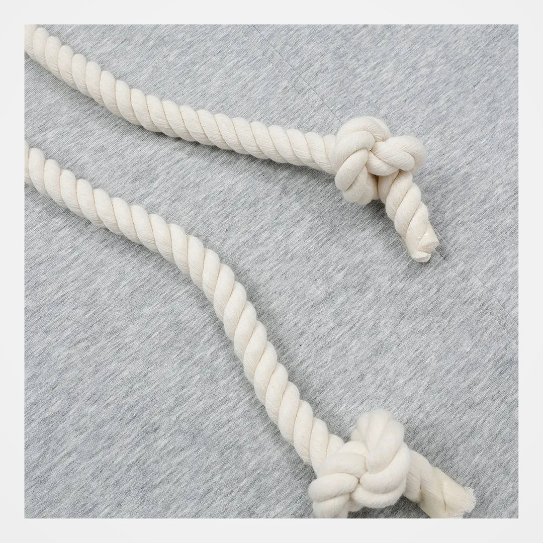 Close-up of the grey polyester fabric and contrast rope belt