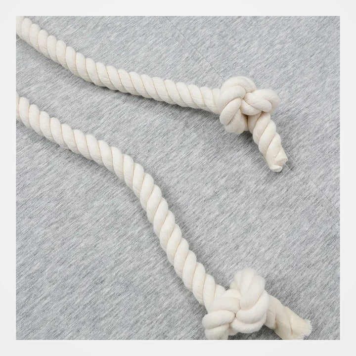 Close-up of the grey polyester fabric and contrast rope belt