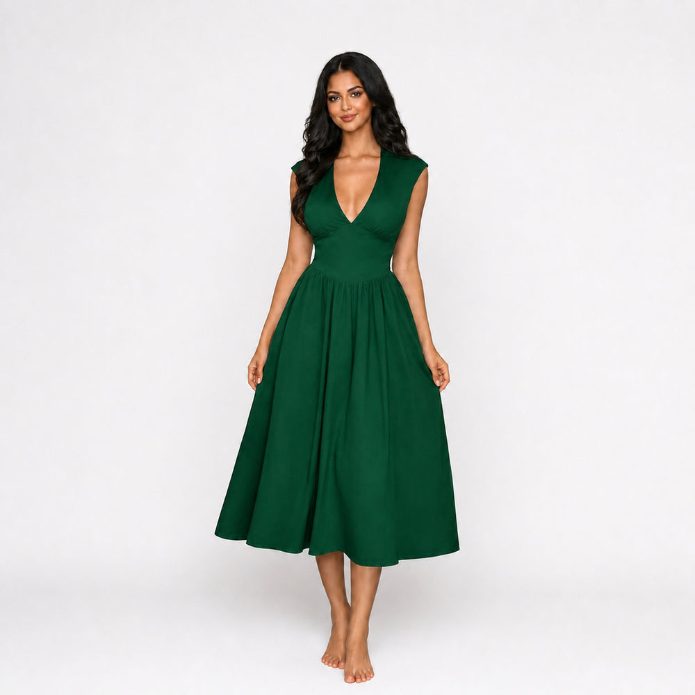 Green padded-shoulder tie-back midi dress on female model, studio front view