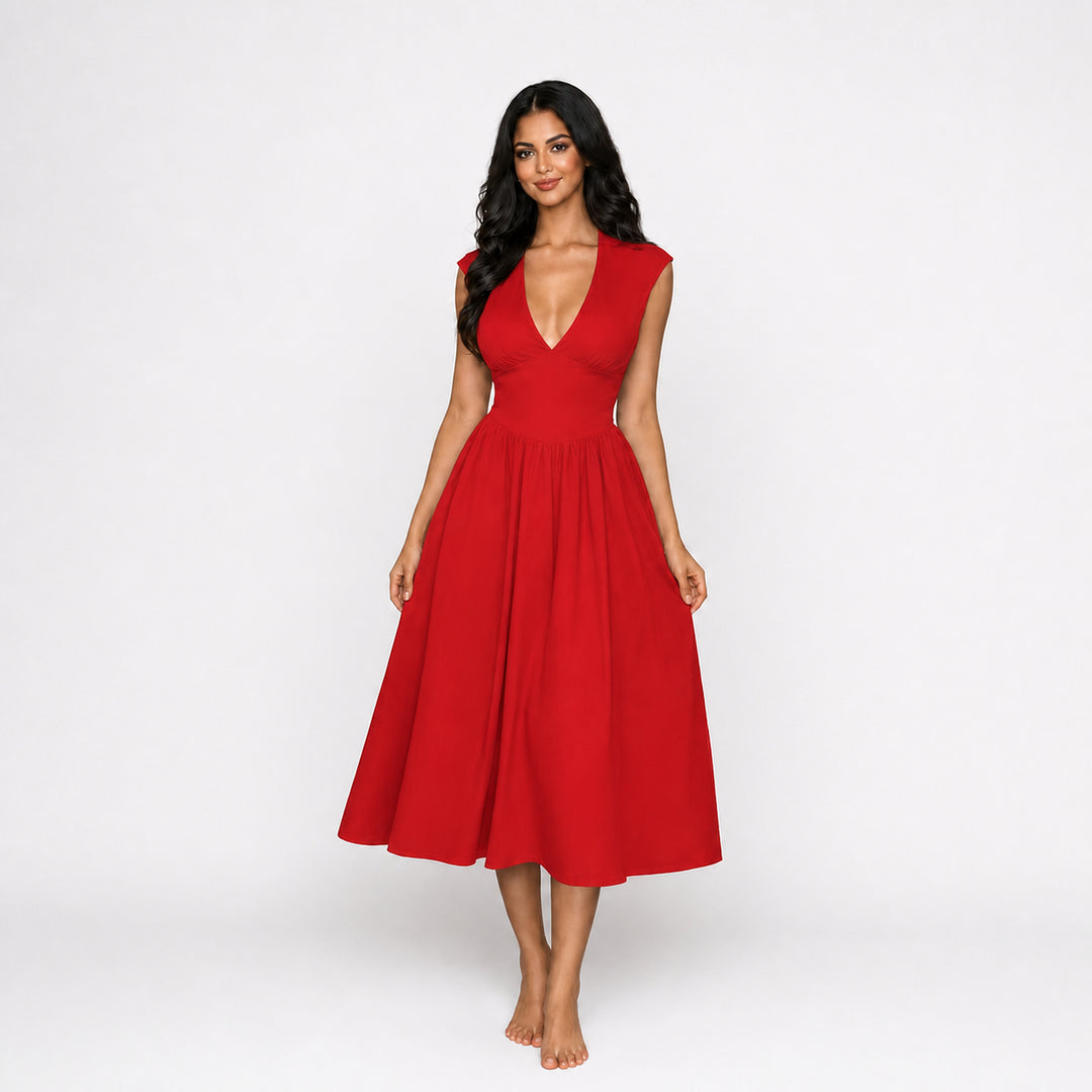 Red padded-shoulder tie-back midi dress on female model, studio front view