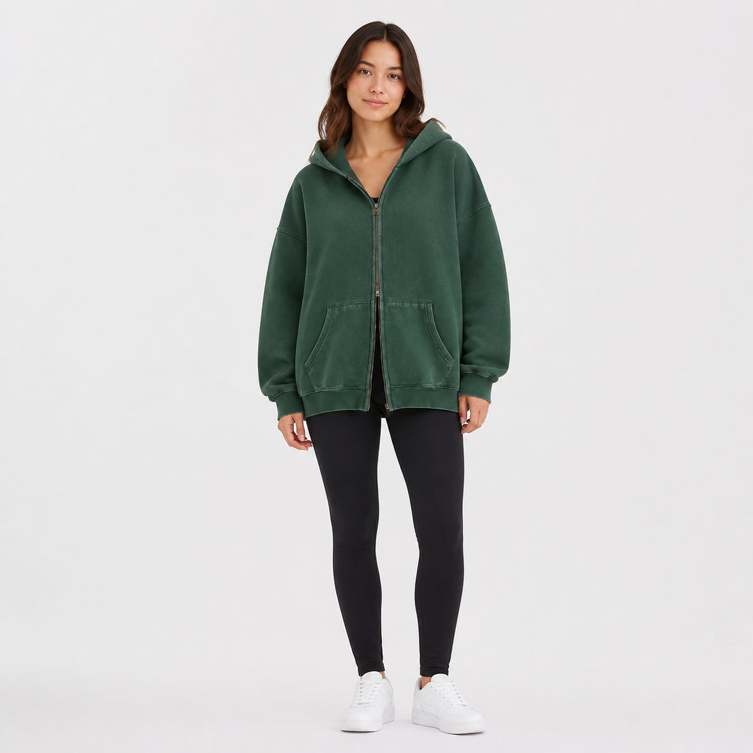 Green oversized double-zip hoodie on female model, studio front view