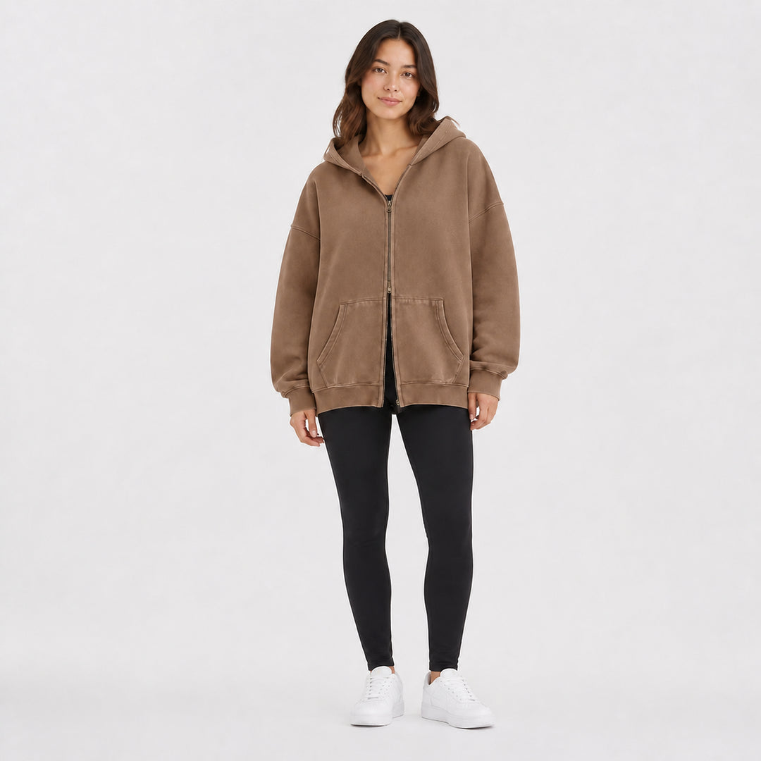 Camel oversized double-zip hoodie on female model, studio front view