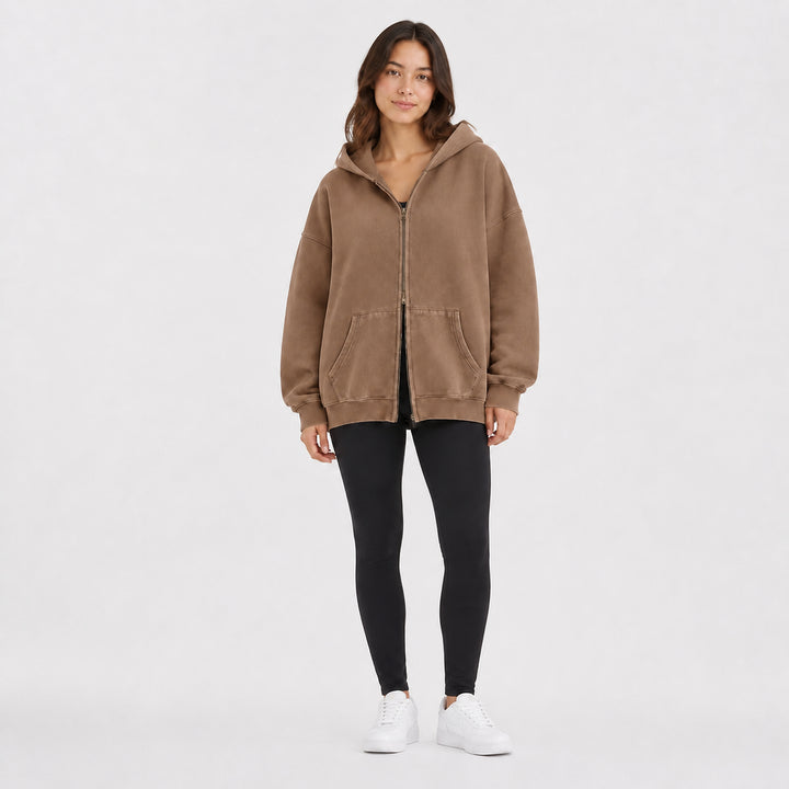 Camel oversized double-zip hoodie on female model, studio front view