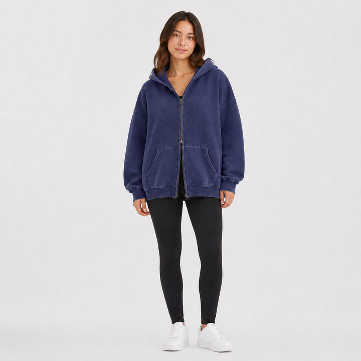 Navy oversized double-zip hoodie on female model, studio front view
