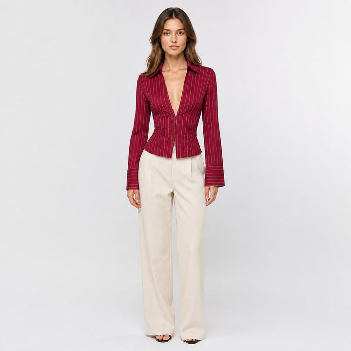 Wine red hook-front striped blouse on female model, studio front view