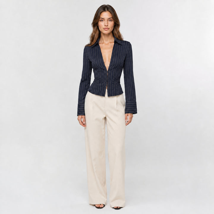 Navy hook-front striped blouse on female model, studio front view