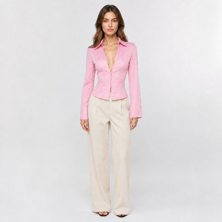 Pink hook-front striped blouse on female model, studio front view